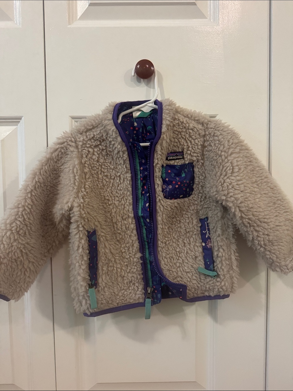 Patagonia Kids Cream Sherpa Jacket with Purple Trim and Floral Accents